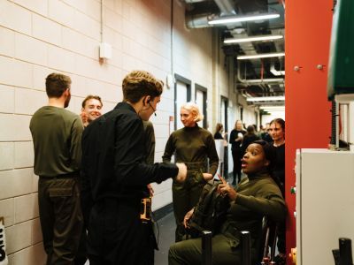 Stage Managers chatting with actors backstage